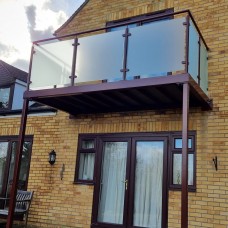 Post Supported Walkout Balcony in Brown Powder Coat, Colour Matched to the Windows, St Neots